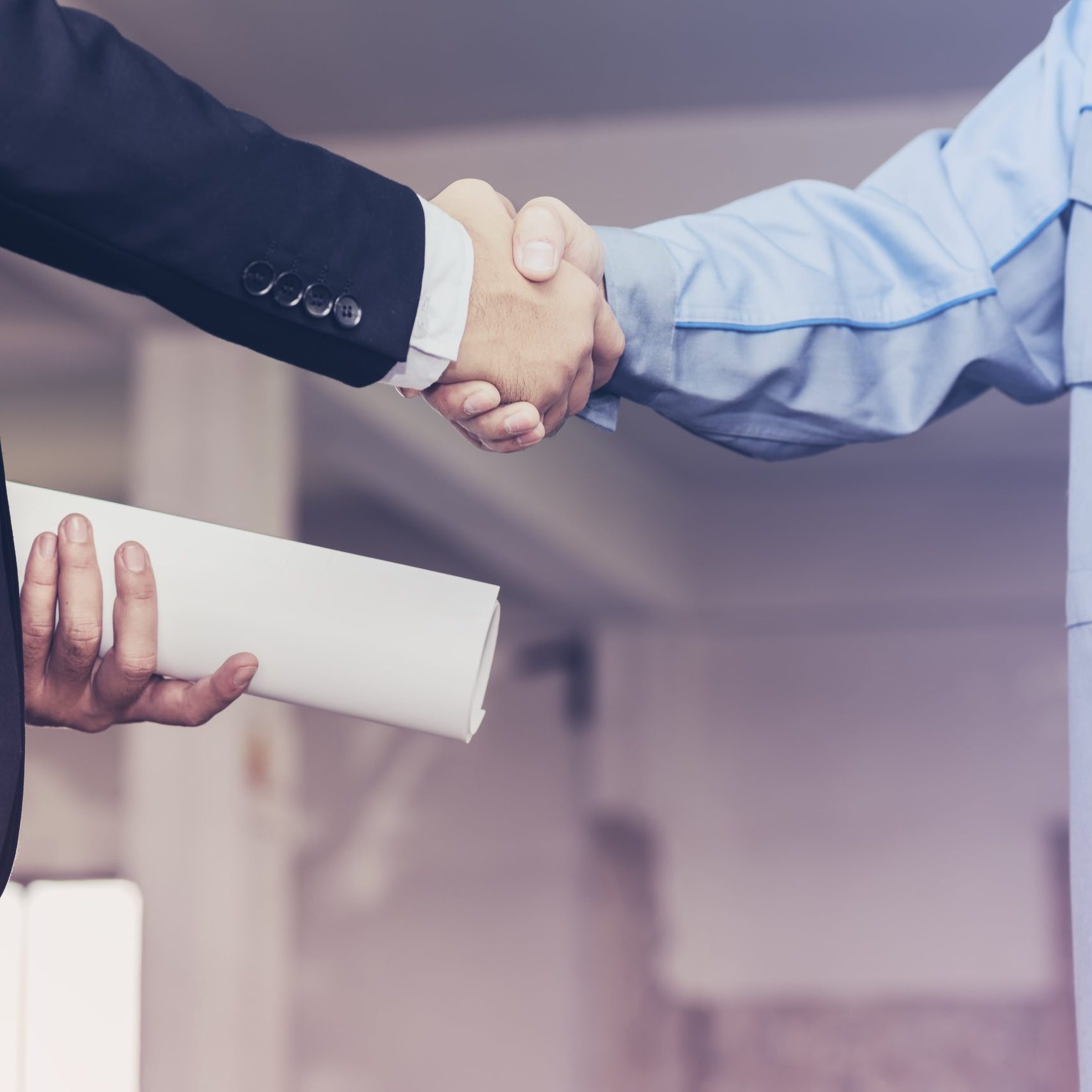 architect-engineer-shaking-hands-with-businessman-site-min
